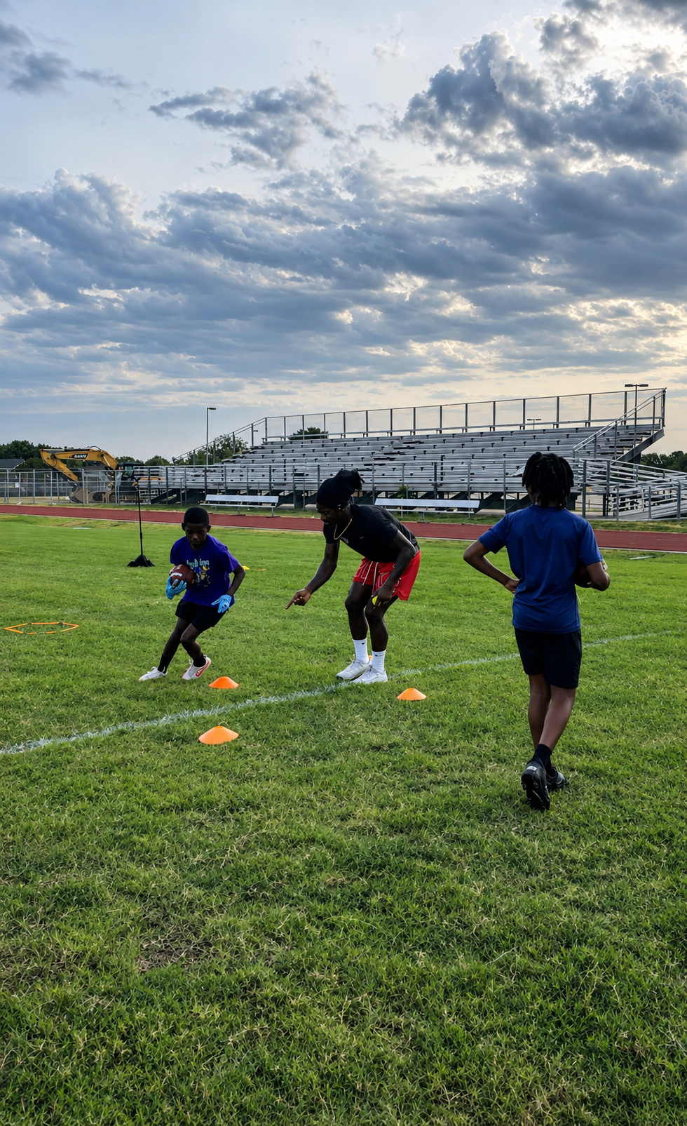 Elite football athlete training under stadium lights